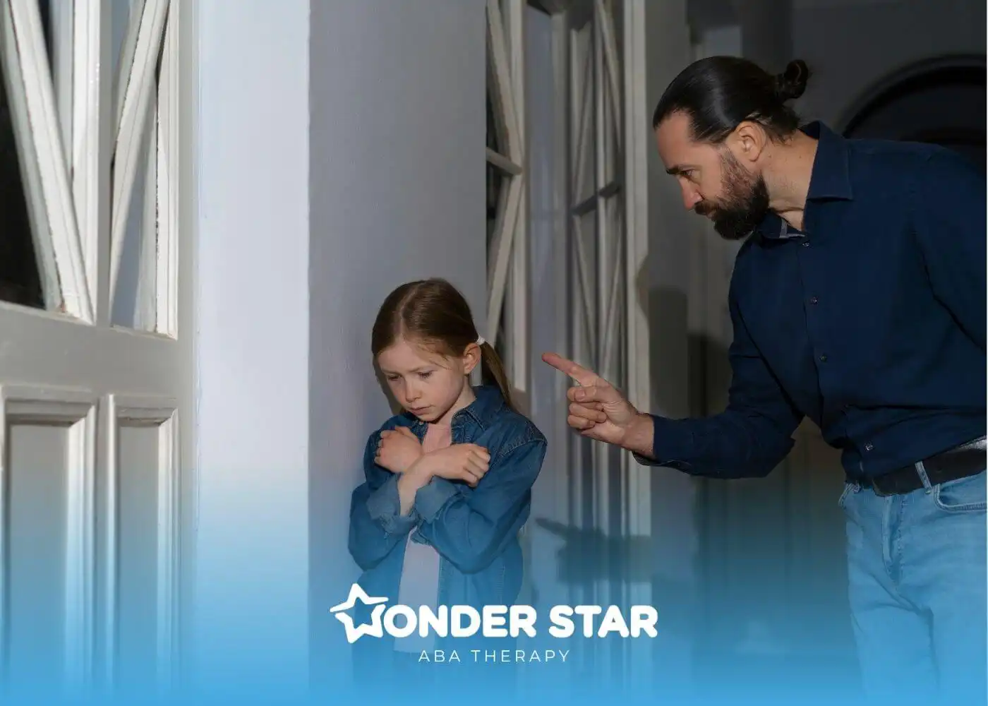 Adult pointing while scolding a sad autistic girl standing in hallway, showing emotional distress and discipline in a home.