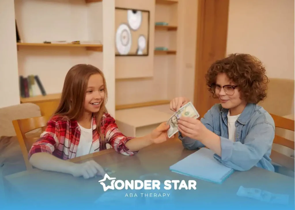 Two autistic children sitting at a wooden table counting money and coins, practicing basic financial and math skills.